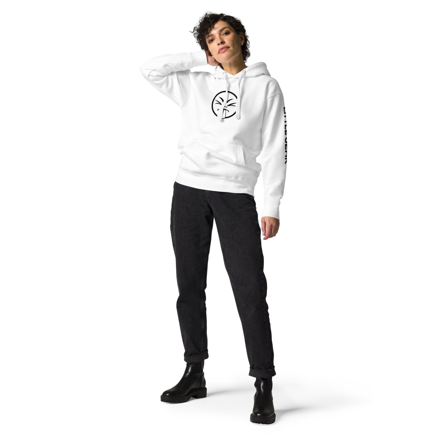 Person wearing a white hoodie and black pants standing confidently.
